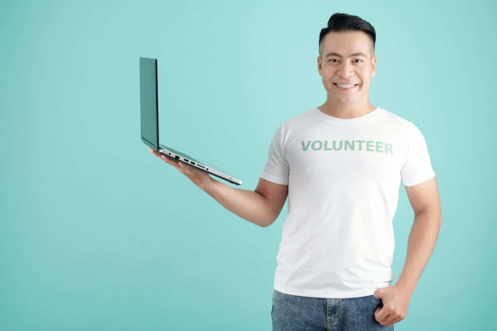 Volunteer with opened laptop