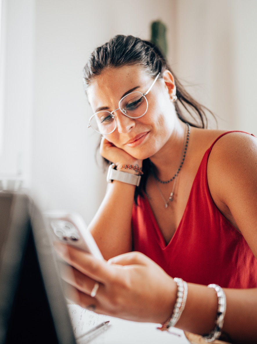 woman reading email on her phone with Apple Mail