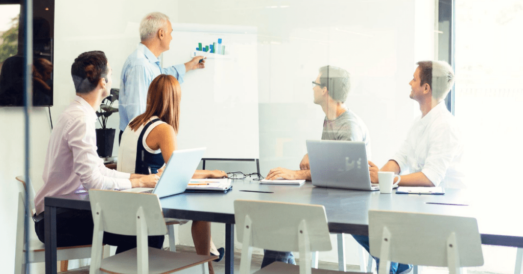 Team discussing association revenue trends