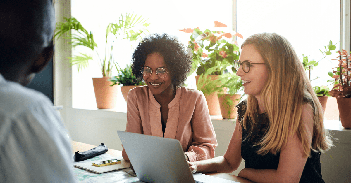 Two employees discuss where to relaunch customer community